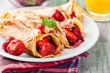 Traditional crepes served with strawberries