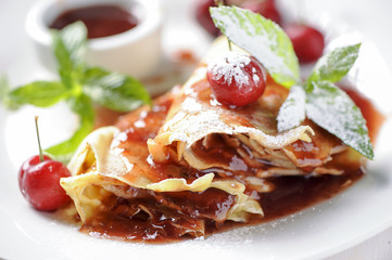 Sweet pancake with jam and cherry 