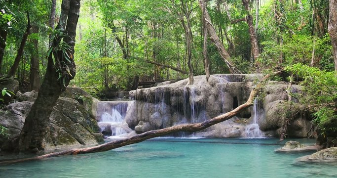 Seamless loop video of wild rain forest waterfall in tropical jungle of Thailand