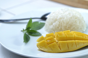 Mango with Sticky Rice.white dish background.