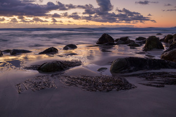 Fototapeta na wymiar Dramatic sunset on an isolated beach