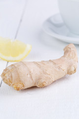 Ginger and green tea on wooden table.