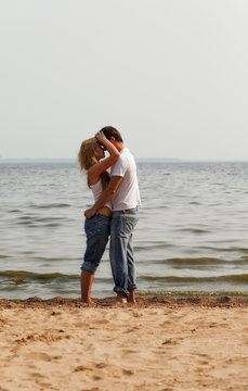 couple embrace on a beach