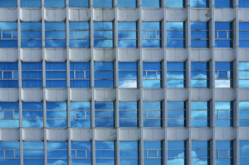 building with Multi windows Reflect Blue Sky