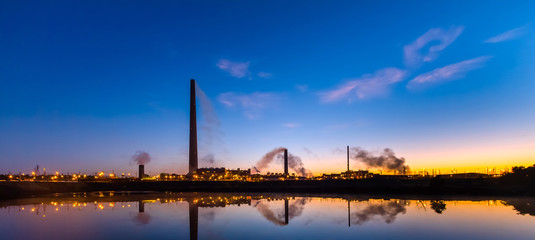 Fototapeta premium Nickel plant with graduated sunrise sky as background