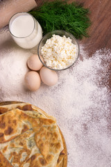 glass cup with milk, a glass bowl with cottage cheese, eggs, flo