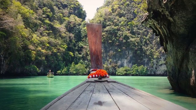Thailand travel background. Exotic tropical island and wooden boat on sea