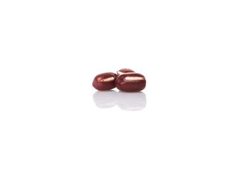 Red adzuki beans over white background