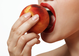 tasty and juicy peaches in a female hand