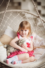 Fototapeta premium Portrait of little girl holding favorite toy