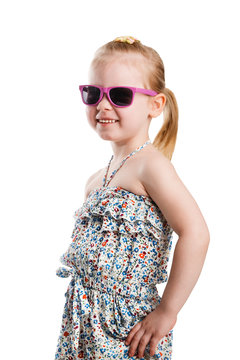 Little fashion girl in sunglasses isolated on white background