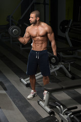 Fototapeta na wymiar Young Man Working Out Biceps