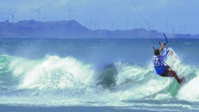 Kitesurfing in ocean slow motion shot. Watersporta at summer