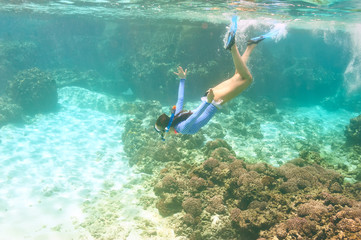 Woman with mask snorkeling