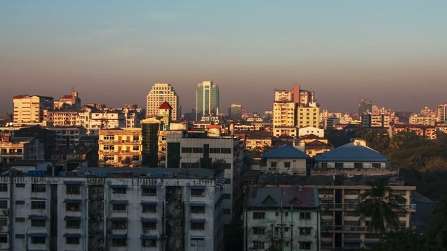 Panoramic view of Yangon, Myanmar at sunrise with moving shadows and sun light