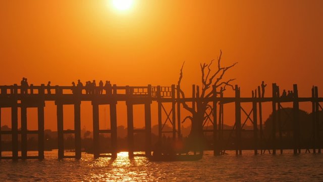 Warm golden color sunset over U Bein bridge in Mandalay, Myanmar