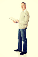 Mature man reading a book