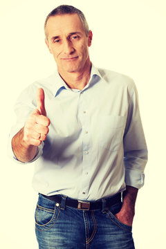 Mature man gesturing ok sign