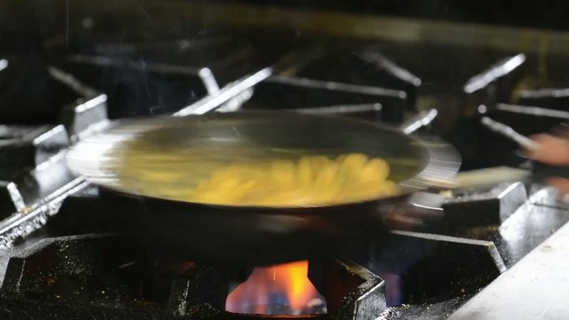 Chef preparing sauce in a restaurant

