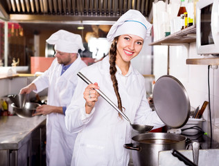 cooks cooking at professional kitchen