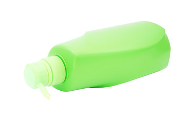 green plastic pump cosmetic bottle on white background