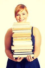 Overweight woman holding books