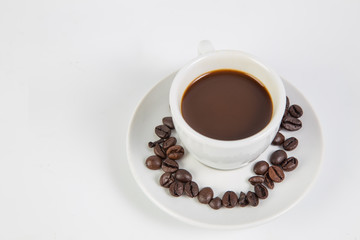 Coffee cup and beans on a white background.
