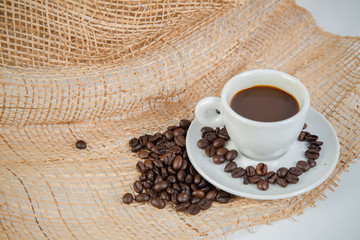 Coffee cup and beans on a white background.