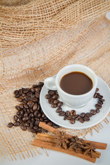 Coffee cup and beans on a white background.