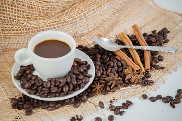 Coffee cup and beans on a white background.