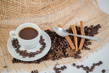 Coffee cup and beans on a white background.