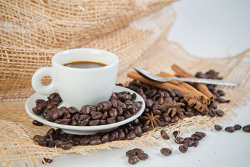 Coffee cup and beans on a white background.