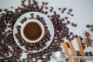 Coffee cup and beans on a white background.