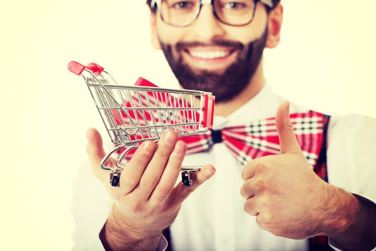 Man Wearing Suspenders With Small Shopping Basket.