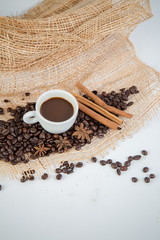 Coffee cup and beans on a white background.