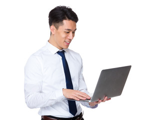 Asian businessman use of notebook computer