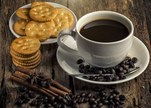 black coffee and coffee bean with biscuits