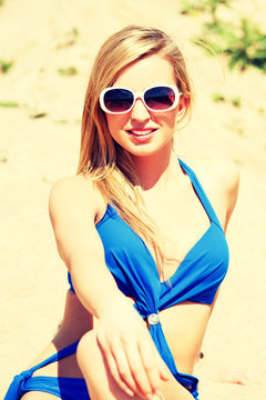 Young Woman In A Blue Swimsuit