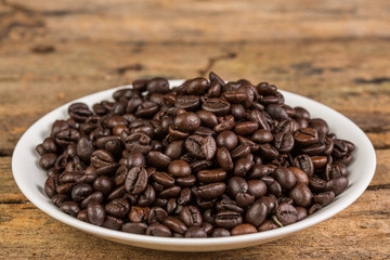 Coffee bean on grunge wooden background