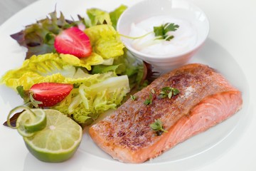 green and healthy food salmon and salad.