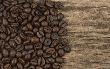 Coffee bean on grunge wooden background
