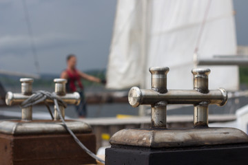 Close-up of mooring bollard with rope in marina