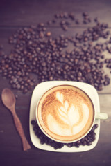 Latte Art coffee with coffee bean vintage color