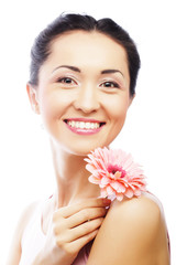 happy asian woman holding a pink gerbera