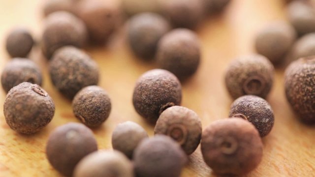 Allspice - pimento seed on rotating display - closeup