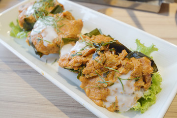 Steamed fish with curry paste on dish