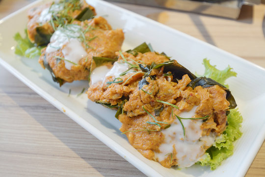 Steamed fish with curry paste on dish