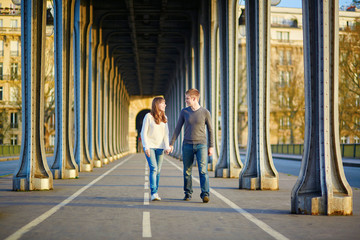 Young couple in Paris on the Bir Hakeim bridge