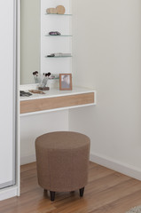 round fabric brown chair in dressing table