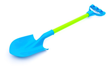 blue plastic toy shovel on a white background